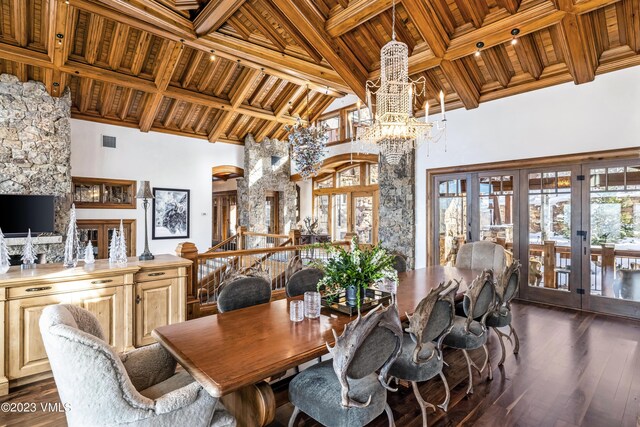 dining area with french doors, wood ceiling, and dark hardwood / wood-style flooring