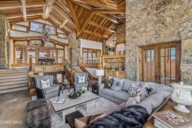 living room with french doors, wood ceiling, beam ceiling, and high vaulted ceiling