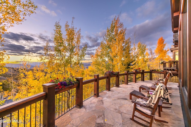 patio terrace at dusk with a balcony