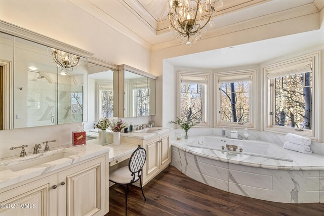 bathroom featuring crown molding, a healthy amount of sunlight, and an inviting chandelier