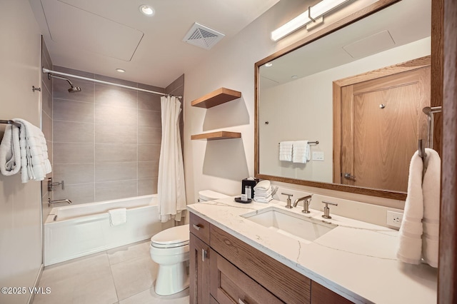 bathroom with visible vents, toilet, shower / bath combo with shower curtain, vanity, and tile patterned flooring