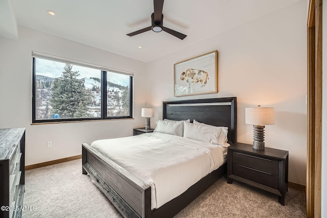 bedroom with light carpet, ceiling fan, recessed lighting, and baseboards