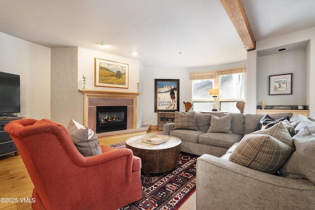 66 Arrowhead Cir Unit 13, Edwards, CO 81632 - living room featuring wood finished floors, a fireplace, beamed ceiling, and recessed lighting