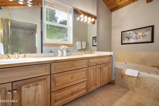 66 Arrowhead Cir Unit 13, Edwards, CO 81632 - bathroom with lofted ceiling, double vanity, a shower stall, a garden tub, and wooden ceiling