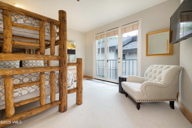 66 Arrowhead Cir Unit 13, Edwards, CO 81632 - carpeted bedroom with access to exterior, baseboards, and lofted ceiling