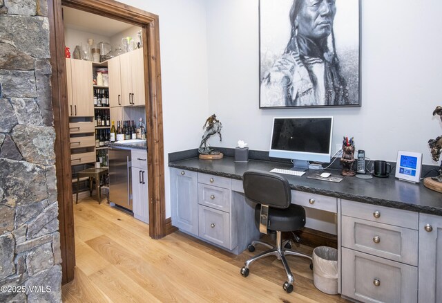 233 Wildflower Ln, Wolcott, CO 81655 - office area featuring light wood finished floors and built in study area