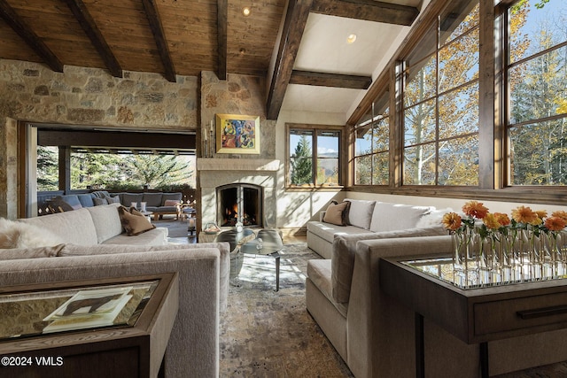 living room with lofted ceiling with beams and wooden ceiling