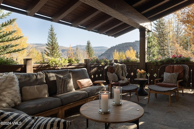 view of patio / terrace featuring a mountain view and an outdoor hangout area