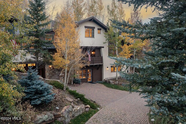 view of front of home with a balcony