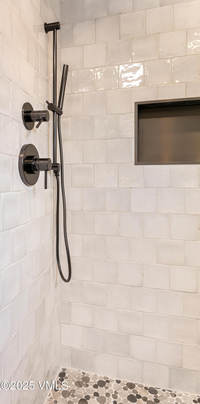 details with a tile shower