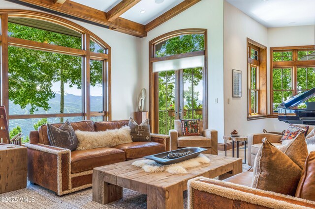 46 Jasmine, Avon, CO 81620 - living room with plenty of natural light, beamed ceiling, and a mountain view
