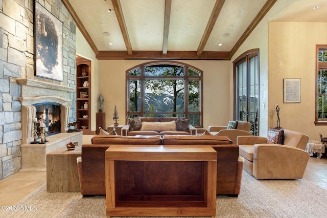 living room with ornamental molding, a fireplace, and beam ceiling