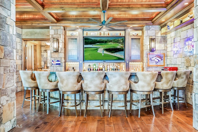 bar featuring hardwood / wood-style flooring, ornamental molding, coffered ceiling, wooden ceiling, and beam ceiling