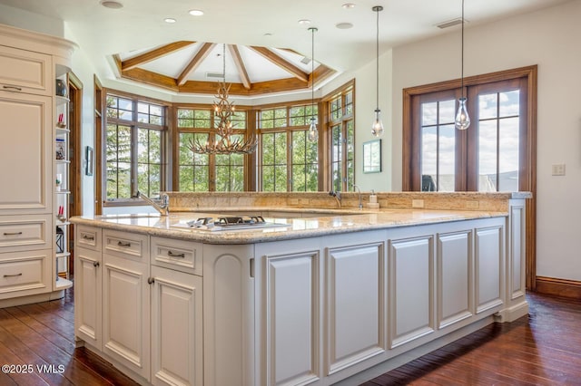 46 Jasmine, Avon, CO 81620 - kitchen with a chandelier, gas cooktop, dark wood-style floors, plenty of natural light, and coffered ceiling