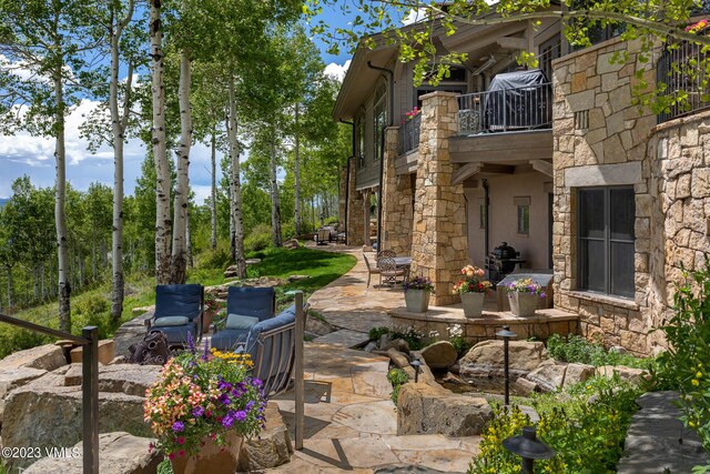 view of patio / terrace with a balcony