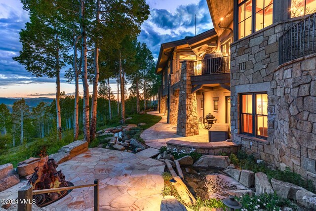 46 Jasmine, Avon, CO 81620 - patio terrace at dusk featuring a balcony and a patio