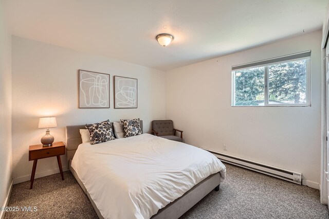 871 W Beaver Creek Blvd Unit A9, Avon, CO 81620 - bedroom with a baseboard heating unit, carpet floors, and baseboards