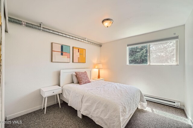 871 W Beaver Creek Blvd Unit A9, Avon, CO 81620 - bedroom featuring baseboard heating, carpet, and baseboards