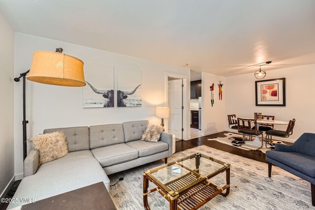 871 W Beaver Creek Blvd Unit A9, Avon, CO 81620 - living room featuring wood finished floors and baseboards
