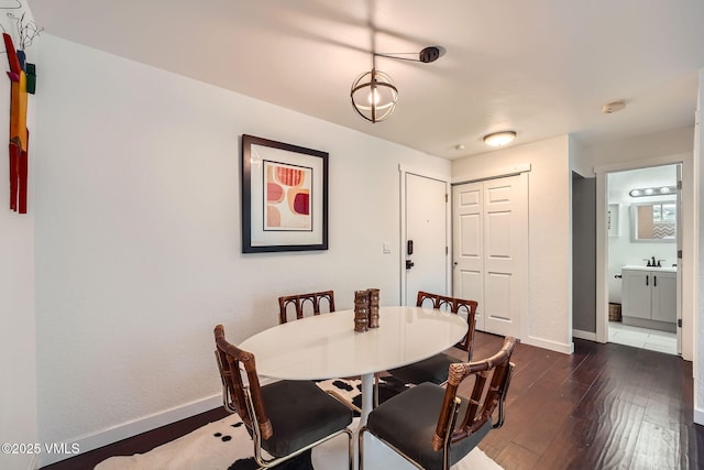 871 W Beaver Creek Blvd Unit A9, Avon, CO 81620 - dining space with dark wood-style flooring and baseboards