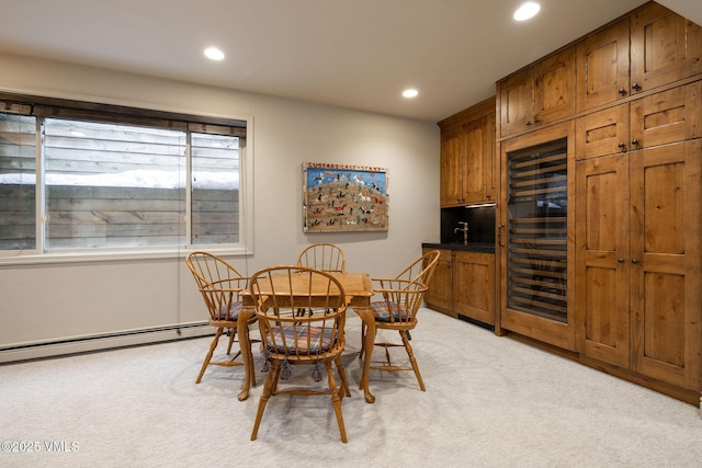 carpeted dining area featuring wine cooler and baseboard heating