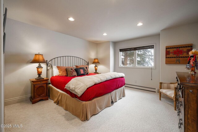 carpeted bedroom with baseboard heating