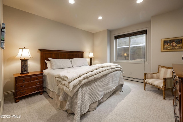 carpeted bedroom with baseboard heating