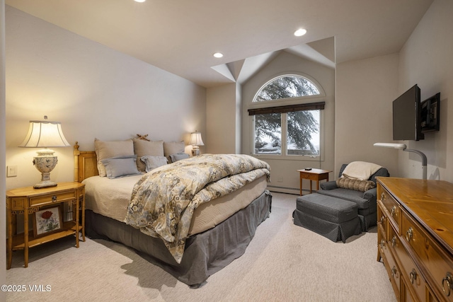 bedroom featuring vaulted ceiling, a baseboard heating unit, and light carpet