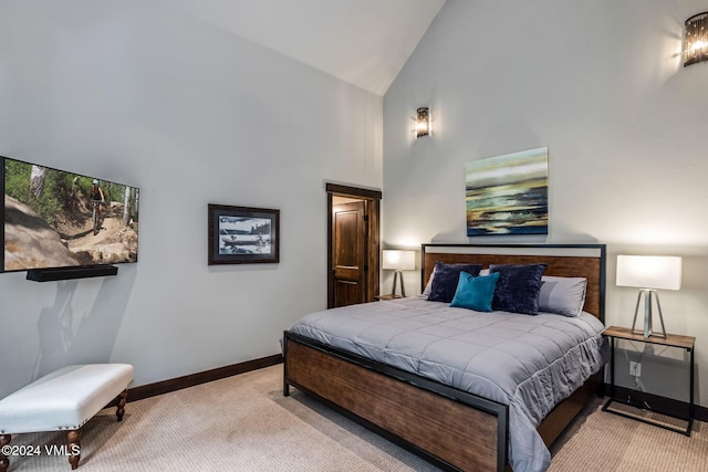 bedroom featuring high vaulted ceiling and light carpet