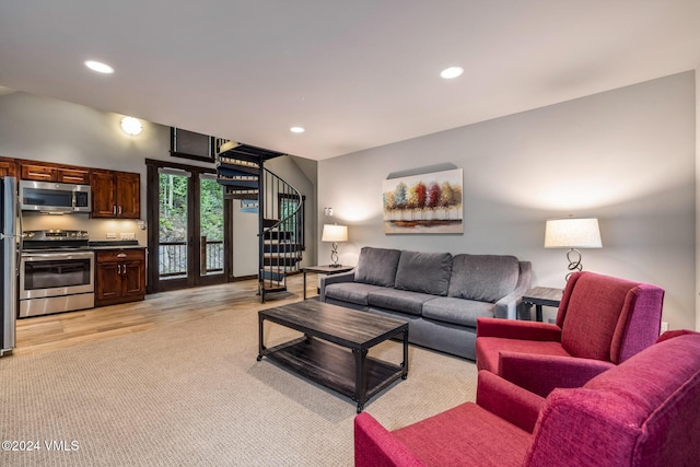 living room featuring light carpet