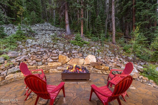 view of patio with a fire pit