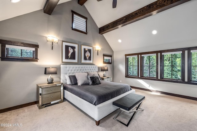 carpeted bedroom with multiple windows, beam ceiling, and high vaulted ceiling