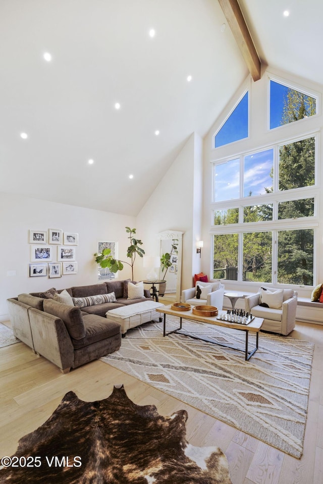 2036 Vermont Rd, Vail, CO 81657 - living area featuring high vaulted ceiling, beamed ceiling, and hardwood / wood-style flooring