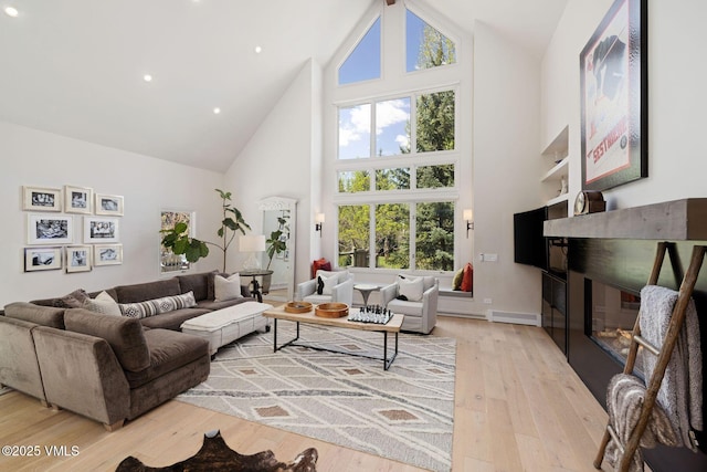 2036 Vermont Rd, Vail, CO 81657 - living area with high vaulted ceiling, wood-type flooring, recessed lighting, and baseboards
