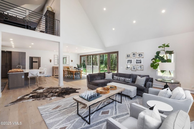2036 Vermont Rd, Vail, CO 81657 - living room with light wood-type flooring, high vaulted ceiling, and recessed lighting