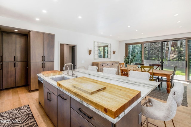 2036 Vermont Rd, Vail, CO 81657 - kitchen featuring a sink, light wood-style floors, recessed lighting, stainless steel dishwasher, and an island with sink