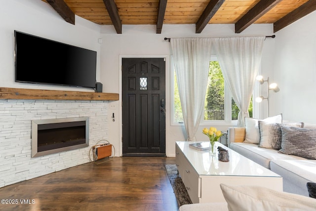 2932 Bellflower Dr Unit B, Vail, CO 81657 - living room with dark wood-style floors, wooden ceiling with exposed beams, and a fireplace
