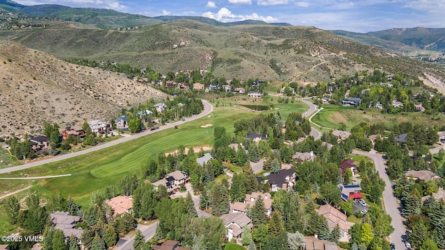 50 Hereford Rd, Edwards, CO 81632 - aerial overview of property's location with a mountain backdrop, nearby suburban area, and a golf course