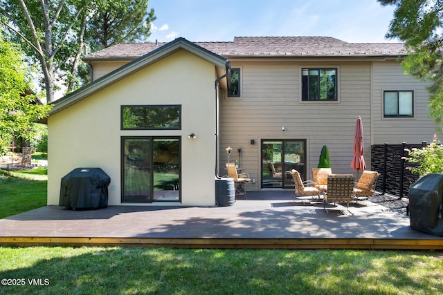 50 Hereford Rd, Edwards, CO 81632 - back of house with a lawn, stucco siding, and a wooden deck