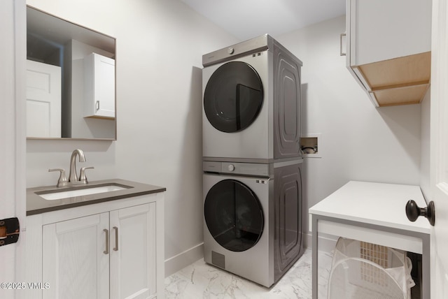 50 Hereford Rd, Edwards, CO 81632 - laundry area with stacked washer / drying machine, cabinet space, and light marble finish floors
