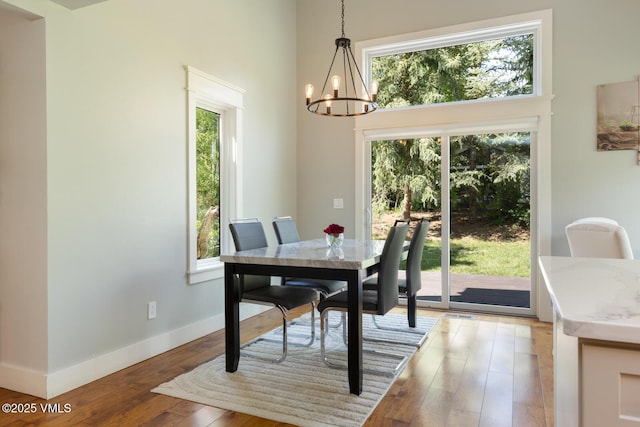 50 Hereford Rd, Edwards, CO 81632 - dining room with a chandelier, wood finished floors, and a high ceiling