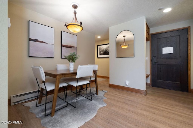 120 Offerson Rd Unit 3002, Beaver Creek, CO 81620 - dining area with baseboard heating, light wood finished floors, baseboards, and recessed lighting