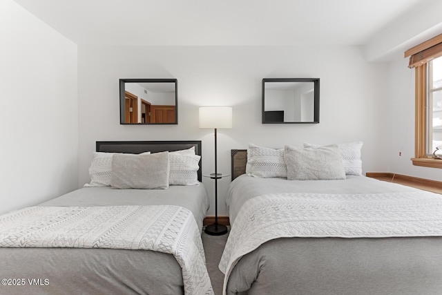 bedroom featuring baseboards