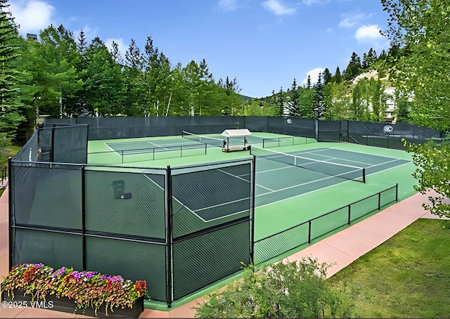 view of sport court featuring fence