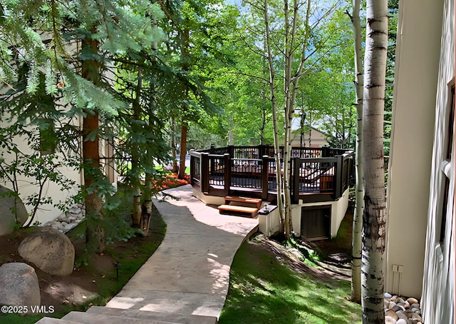 surrounding community featuring a deck