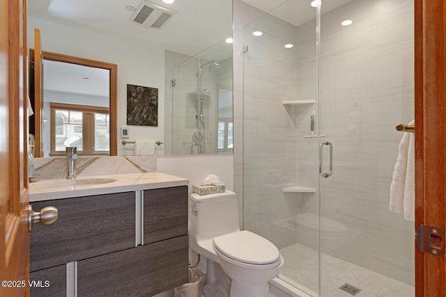 full bath featuring visible vents, a shower stall, toilet, and vanity