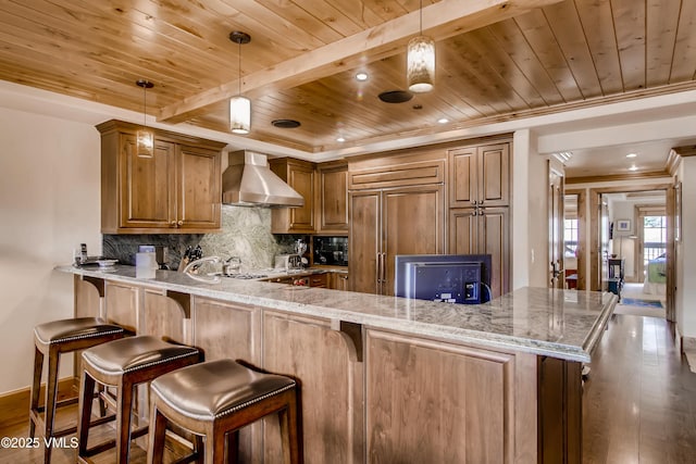 434 S Frontage Rd E Unit 403, Vail, CO 81657 - kitchen featuring wall chimney range hood, wood ceiling, a peninsula, backsplash, and wood finished floors