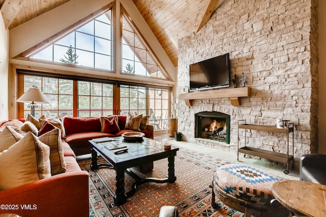 434 S Frontage Rd E Unit 403, Vail, CO 81657 - living area featuring a wooden ceiling with exposed beams, high vaulted ceiling, and a stone fireplace