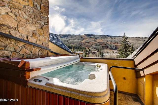 434 S Frontage Rd E Unit 403, Vail, CO 81657 - view of pool with a hot tub and a mountain view