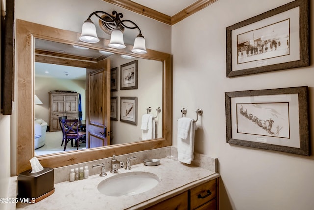 434 S Frontage Rd E Unit 403, Vail, CO 81657 - bathroom featuring crown molding and vanity